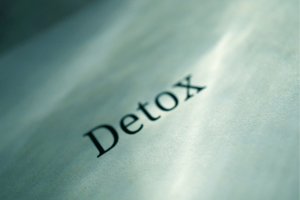 Close-up of the word 'Detox' on a document, symbolizing the process of heavy metal detox, a method to cleanse harmful toxins from the body.