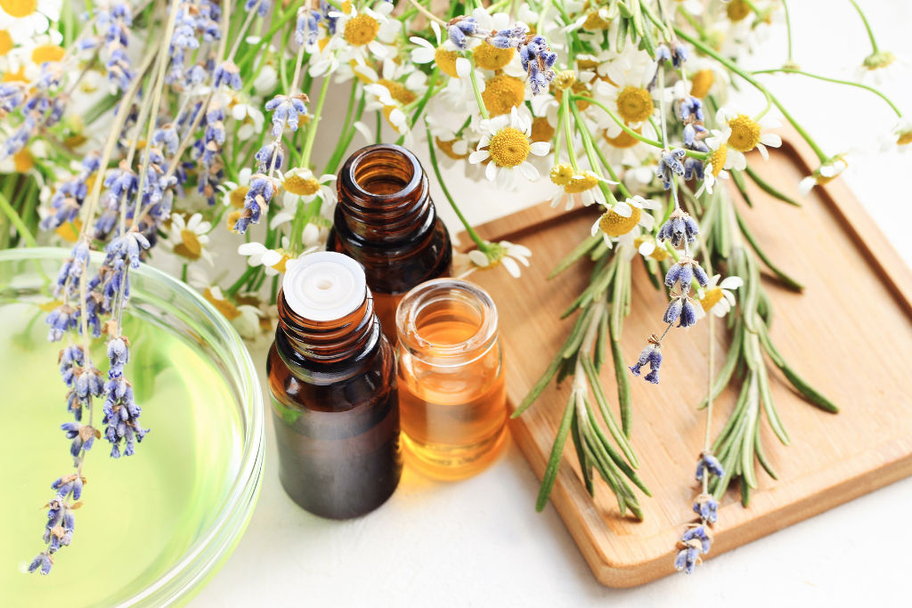 Essential oils and fresh herbs symbolizing the Benefits of Holistic Health through natural remedies and wellness practices.